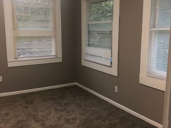Unit 5 - Living room with lots of natural lighting.