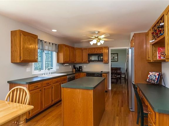 Thoughtfully designed, eat-in, kitchen with plenty of storage space, built-ins including a desk area