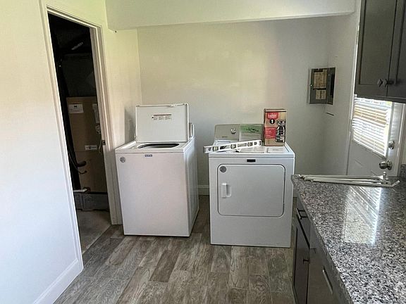 Washer and dryer to be installed May 15th. Patio located through door on the right, and storage room with utility sink to the left.