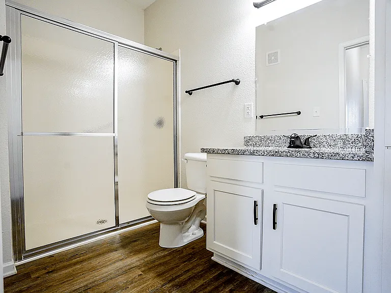 Designed for real life and providing ample storage, a wide vanity, and a modern walk-in shower, enjoy a bathroom that works beautifully every day.