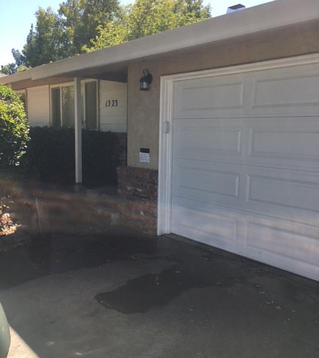 Roll-up garage door with automatic opener