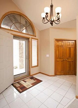 The spacious foyer features ceramic tile.