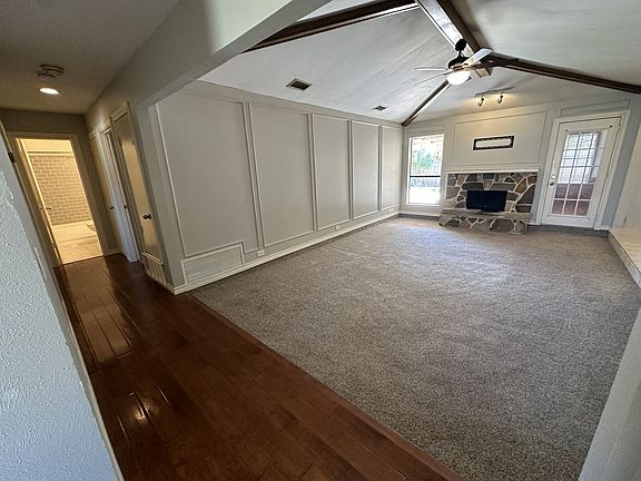 Large living room with TV mount above fireplace ready for your TV.