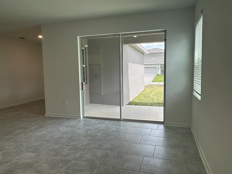 Living area with sliding door access to the backyard