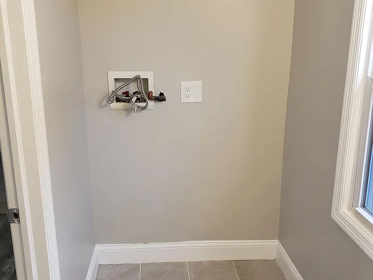Laundry, in half bath downstairs.