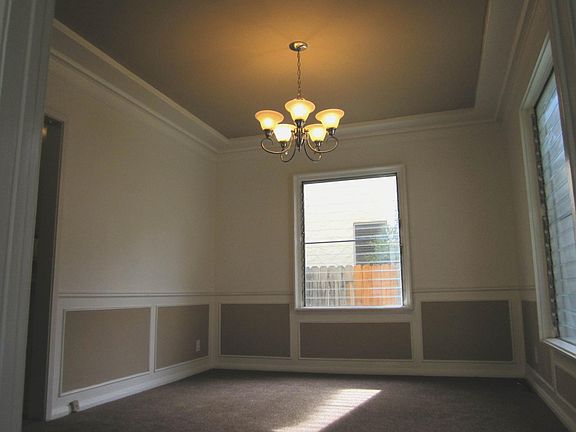 Dining Room with 2-tone paint highlight crown moldings