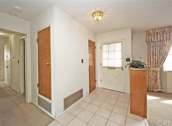 Entryway with screen security door and coat closet