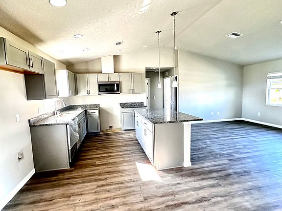 Kitchen comes with refrigerator, range, dishwasher and microwave.