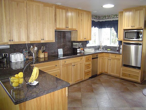 Remodeled kitchen with stainless steel appliances.