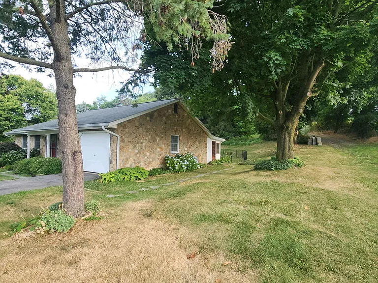 Side of house with garage view and back porch