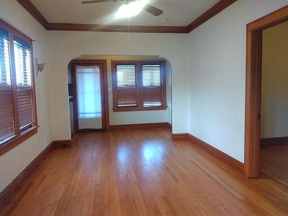 Living room to enclosed front porch. Second bedroom to the right