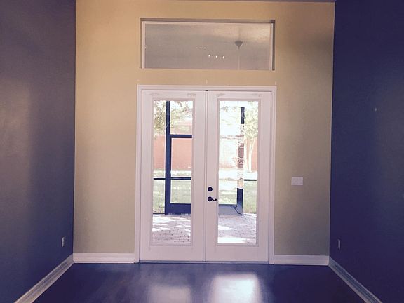 Formal Living Room Leading to screened patio and fenced back
