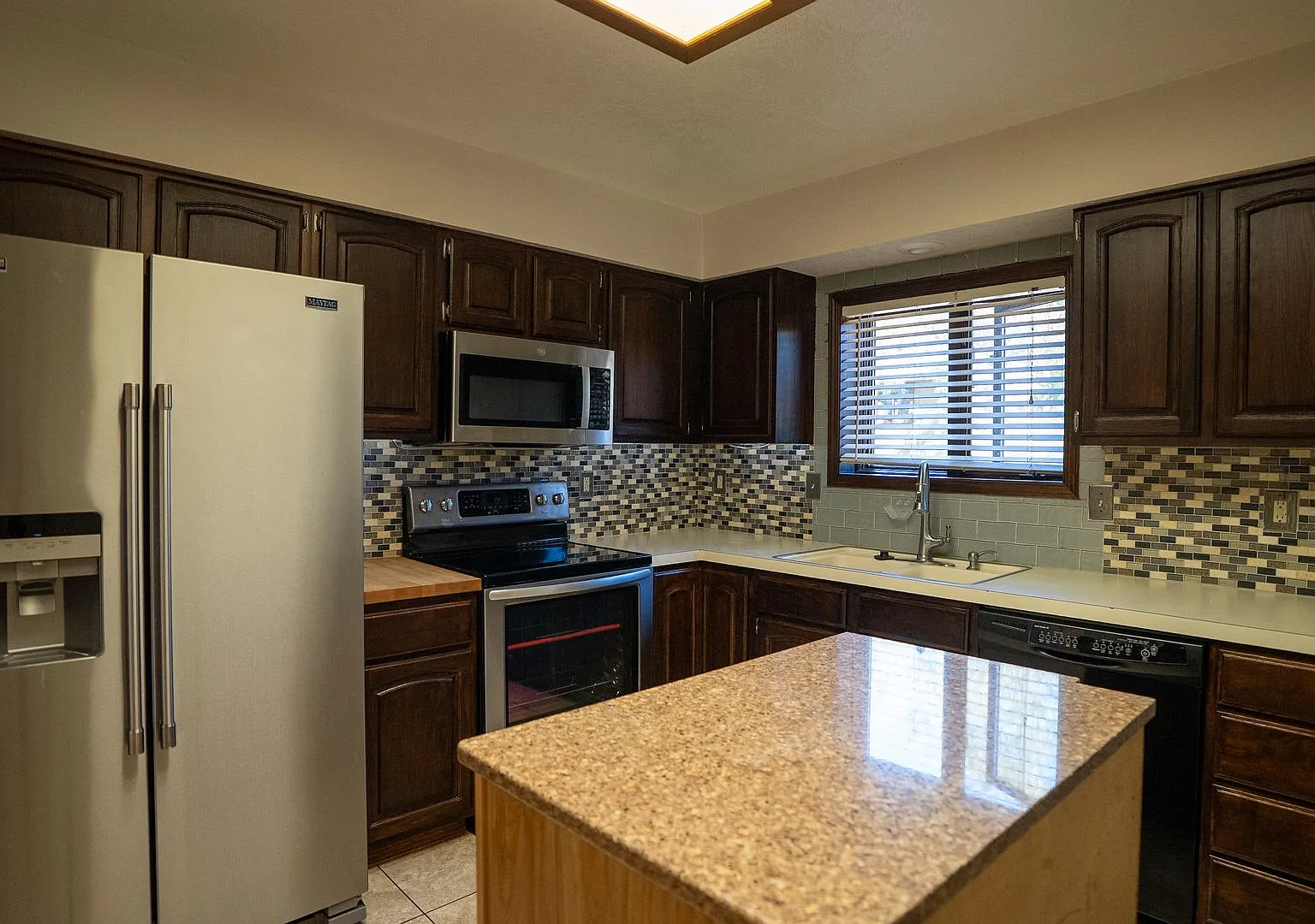 4-Bedroom Home with Finished Basement & Attached Garage — Photo 3