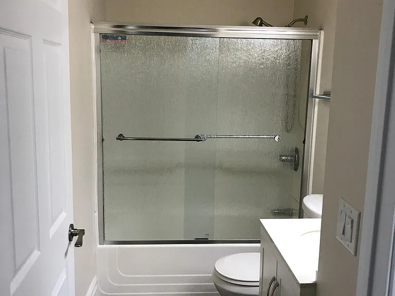 Updated Bath , new shower doors.