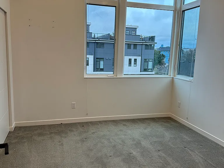 Master bed room. Heater/air conditioner unit on wall above top of picture (not shown).