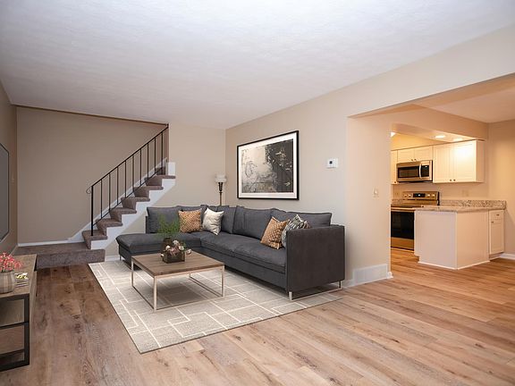 Living room flows to dining room and kitchen. Luxury vinyl plank flooring throughout the main floor.