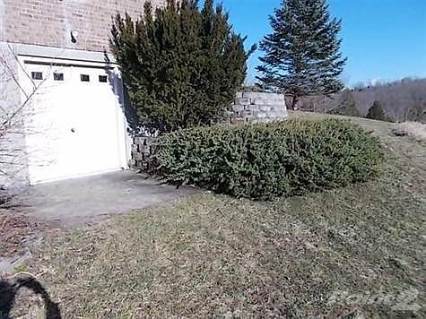 Walkout from basement on west side of house.  (on left looking at it from front yard). Double door opening makes easy ingress/egress for larger items.
