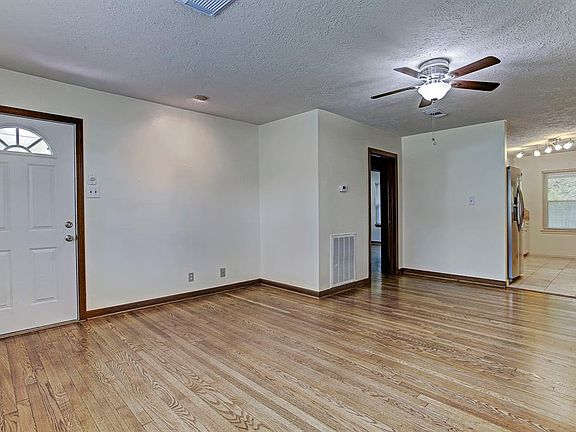 THIS CAPTIVATING HOME OFFERS WARM NEUTRAL TONED PAINT THROUGHOUT!