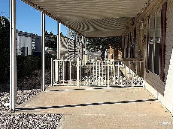 Covered, fenced front porch