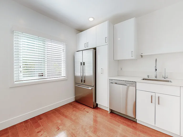 LARGE KITCHEN HAS NEW CABINETS, APPLIANCES AND COUNTERTOPS