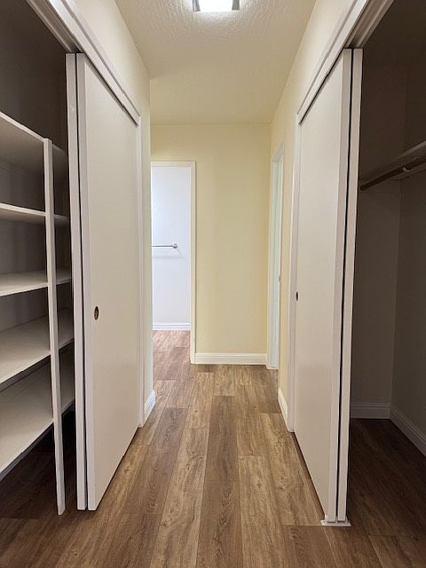 Hallway lined with closets for extra storage