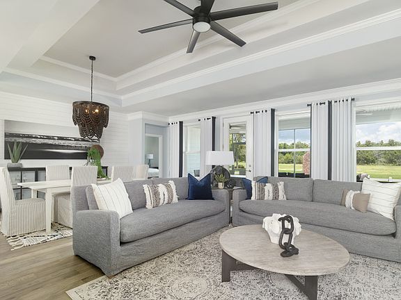 Relaxing Gathering Room with hardwood floors and plenty of space to entertain guest