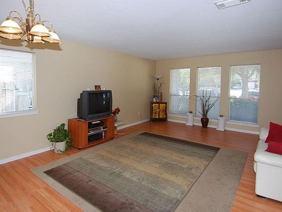 The front room has lots of wonderful windows, it has beautiful floors and is painted with tasteful colors.