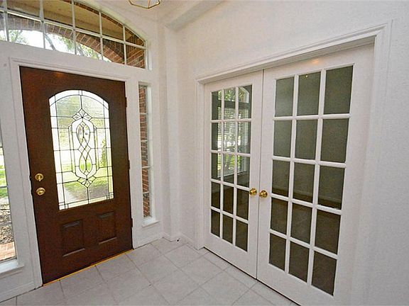 Lots of natural lighting in this home! High ceilings, crown molding, and transom windows make this f
