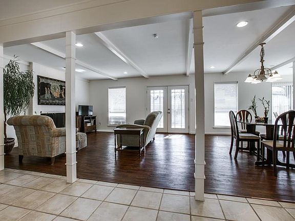Wood look laminate floors. New French Doors open to the patio area.