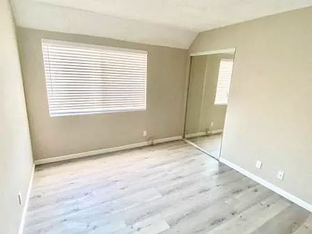 210 Garfield unfurnished bedroom with mirror closet