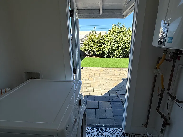 Laundry room and back door to private yard