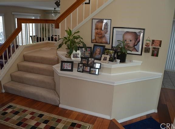 As you entry you have view of living area with stairs leading to the upstairs bedrooms. To the right