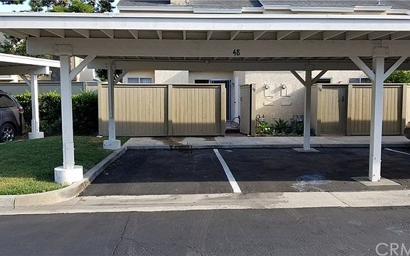 TWO side by side covered carports dedicated to your home, right outside your rear patio security gate.