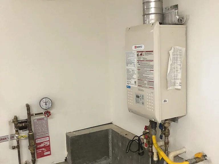 Tankless water heater in the garage.
