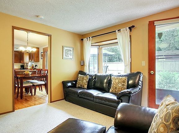 Family Room with bay window and berber carpet.