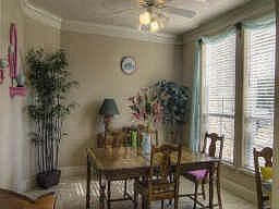 The formal dining room could also serve as a study and features large windows overlooking the beauti