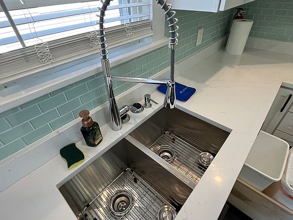 Elkay extra-deep double under-mount sink with Moen faucet and soap dispenser