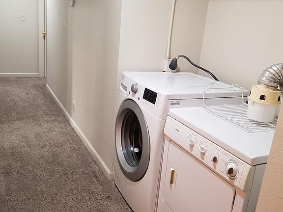 Laundry, walkway to the kitchen, living, and master bed