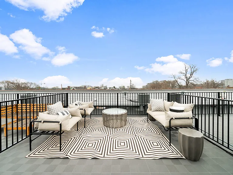 Rooftop deck with solar panels, gas connection, and electrical outlets