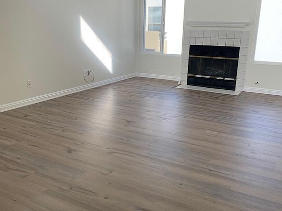Living Room Area - View of gas fireplace - new flooring