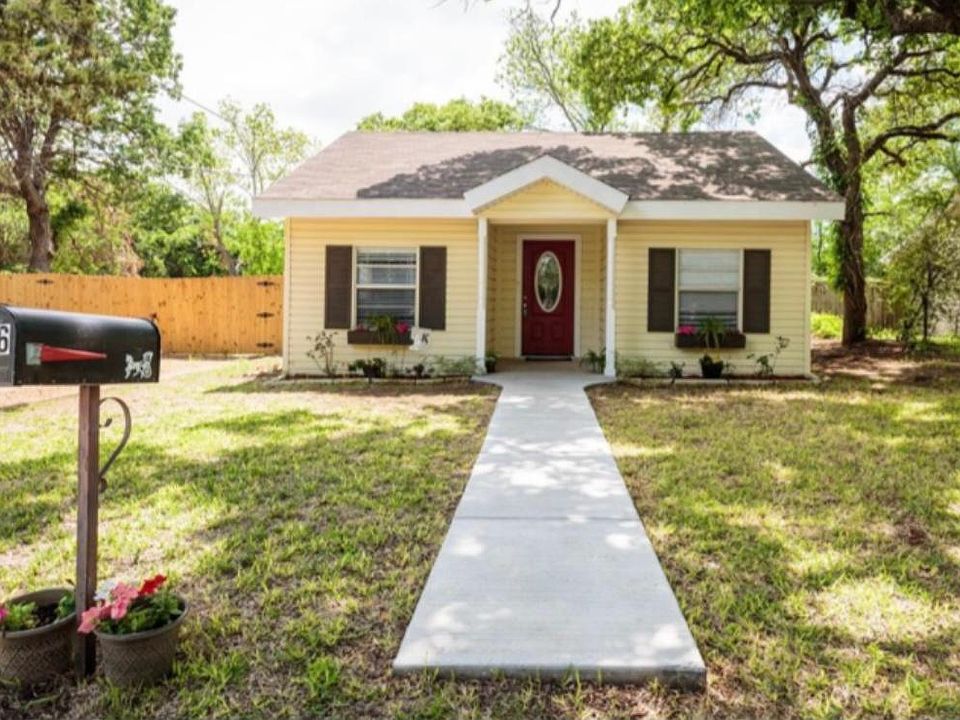 Front view of home. Home is shotgun style, well laid out making it much larger than it looks. Sidewalk now goes all the way to the newly paved street.