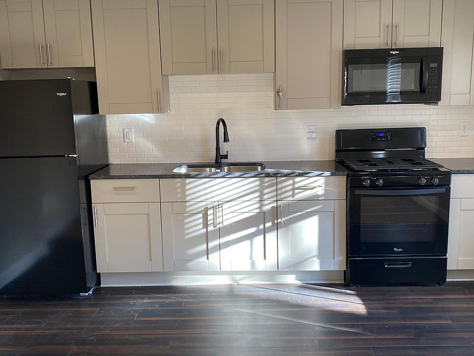 Full, brand new kitchen and appliances with granite countertops and custom cabinets