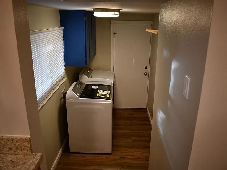 Laundry room with new washer and dryer