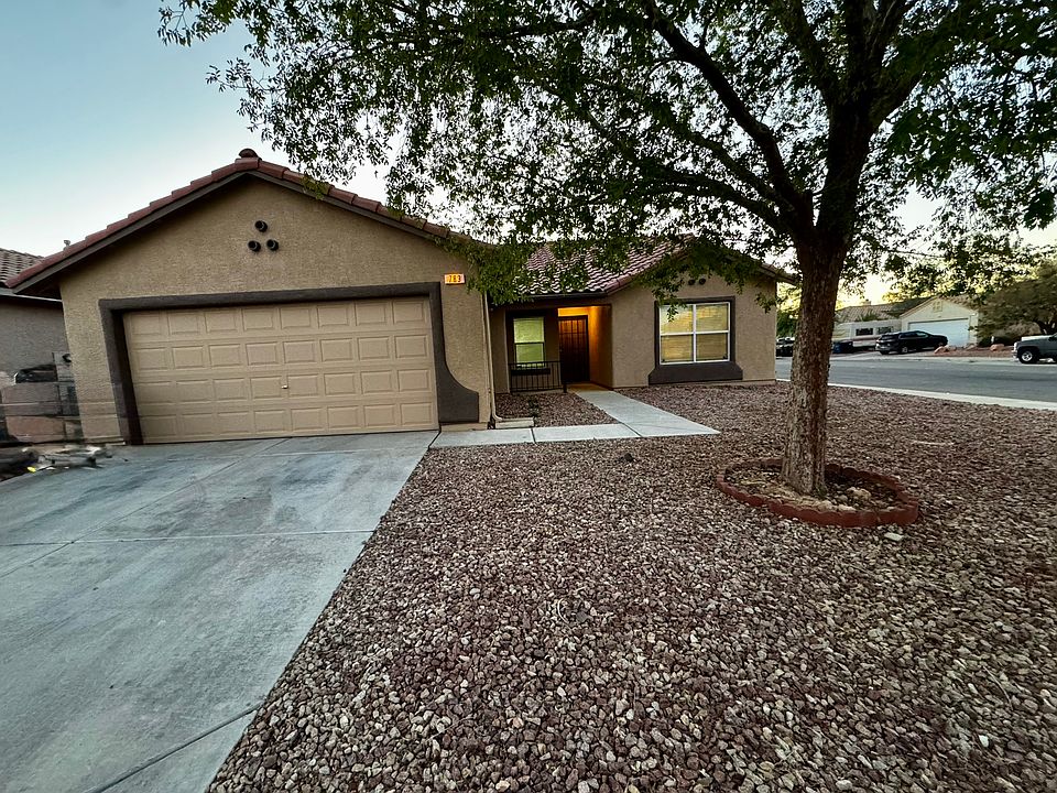 Beautiful single-story home with two-car garage and mature shade tree in the front yard.