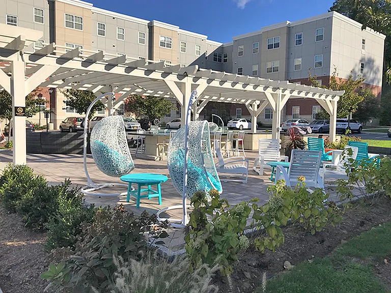 A comfortable pergola-covered space for gathering or relaxing.