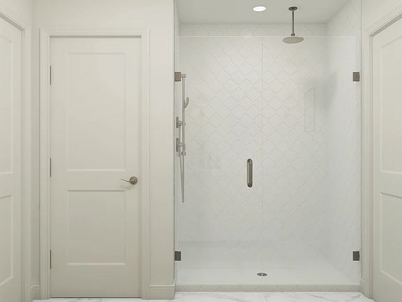 Primary bath with glass shower enclosure