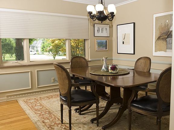 Formal dining room with wainscotting.