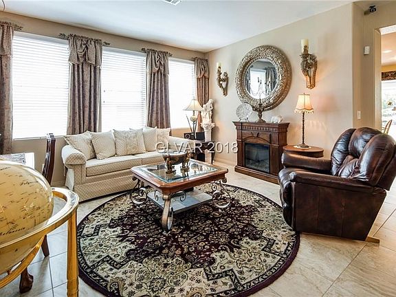 Formal Living Room ..Upgraded Tile.. Drapes. Designer Paint..Living Room 14x13