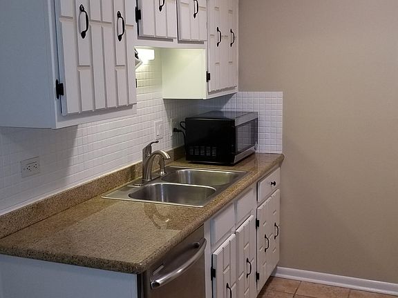 Stainless steel dishwasher as well as new microwave. Granite countertops. New kitchen faucet.