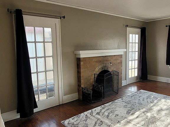 living room with wood burning fireplace